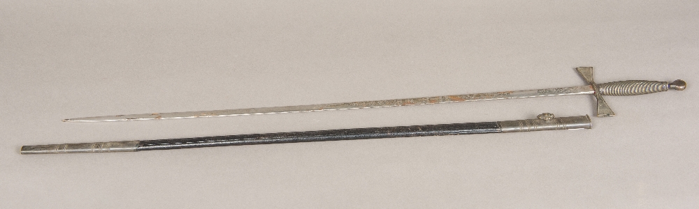 A ceremonial Masonic sword With leather scabbard, the blade typically decorated.