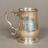 A George III miniature silver tankard, hallmarked London 1766,