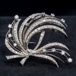 An 18 ct white gold diamond set brooch Of spray form, set with approximately 3 carats of diamonds.