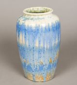 A Ruskin pottery vase With all over blue crystalline glaze, impressed marks to base. 25 cm high.