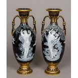 A pair of Sevres style pate-sur-pate type twin handled vases Each worked with scantily clad females,