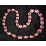 A Georgian unmarked gold pink topaz set necklace 36 cm long.