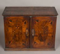 An 18th century marquetry and parquetry inlaid walnut table cabinet The parquetry inlaid