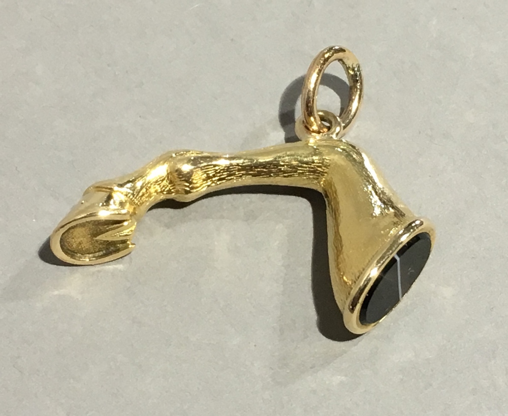 A gold plated agate set fob seal Modelled as a horse's leg. 3.5 cm wide.