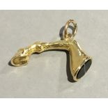 A gold plated agate set fob seal Modelled as a horse's leg. 3.5 cm wide.