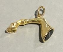 A gold plated agate set fob seal Modelled as a horse's leg. 3.5 cm wide.