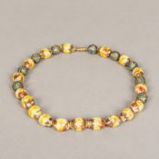 A Venetian glass bead necklace Set with Chinese enamel decorated unmarked white metal beads. 45.