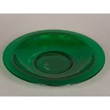 A Peking green glass charger Of large dished form. 40 cm diameter.