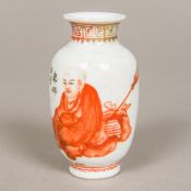 A 19th century miniature Chinese porcelain vase Decorated to one side with Buddha seated before a