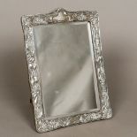 An Art Nouveau silver framed mirror, hallmarks indistinct,