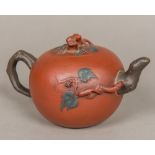 A Chinese Yixing teapot Of ovoid form, with scrolling branch decorations,