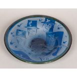 A Kosta Boda blue Art glass bowl Decorated with various stylised heads wearing top hats,