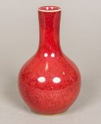 A Chinese porcelain vase With allover sang de boeuf glaze. 14.5 cm high.