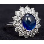 A 9 ct white gold diamond cluster ring - WITHDRAWN Centred with a synthetic corundum cabochon.