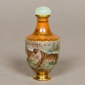 A Chinese inside painted glass snuff bottle Worked with tigers amongst a mountainous landscape and