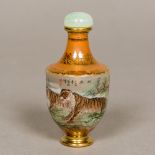 A Chinese inside painted glass snuff bottle Worked with tigers amongst a mountainous landscape and