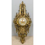 A gilt brass cased cartel clock Of large pierced architectural form,