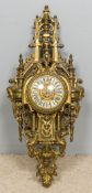 A gilt brass cased cartel clock Of large pierced architectural form,