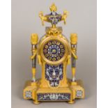 A 19th century French cloisonne decorated ormolu mantel clock The fruiting twin handled urn above a
