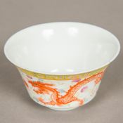 A Chinese porcelain bowl Decorated with a phoenix and five-clawed dragon chasing a flaming pearl