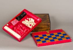 A part games compendium by W & J Milne, Edinburgh Comprising: a carved and stained bone chess set,