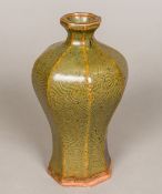 A Chinese Song porcelain baluster vase Of octagonal section, with incised arabesque decoration.