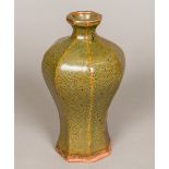 A Chinese Song porcelain baluster vase Of octagonal section, with incised arabesque decoration.