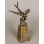 An early 20th century patinated bronze model of a flying fish Typically modelled,