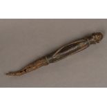 An African metal mounted carved wooden tribal staff Of figural form, with a metal tip. 35.
