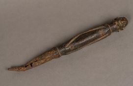 An African metal mounted carved wooden tribal staff Of figural form, with a metal tip. 35.