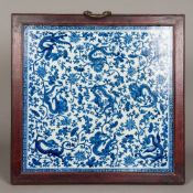 A Chinese blue and white porcelain plaque Extensively worked with dragons amongst lotus strapwork,