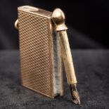 A George V 9 ct gold novelty fob striker by Asprey Modelled as a book. 5 cm long overall.