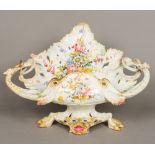 A large 19th century Le Nove faience pottery centre piece Of scrolling leaf form,