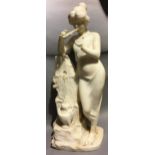 A 19th century carved marble sculpture Modelled as a young lady playing a double pipe,