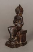 An antique Indian patinated bronze figure of Buddha Typically modelled seated. 16.5 cm high.