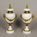 A pair of gilt bronze mounted white marble urns Of classical form,