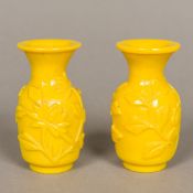 A pair of Chinese Peking glass vases Each yellow ground, carved in the round with floral sprays,