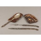 An 18th century German silver mounted gilt heightened polished steel travelling cutlery