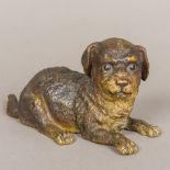 A 19th century French cold painted bronze inkwell Formed as a recumbent puppy with hinged neck.