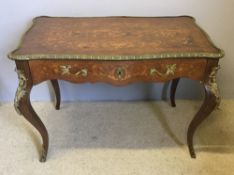 A 19th century marquetry inlaid and bronze mounted centre table The scrolling florally inlaid