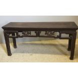 A 19th century Chinese hardwood low table Of alter table form,