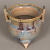 A Chinese pottery censer Of squat twin handled form, with blue and purple glaze. 12.5 cm high.