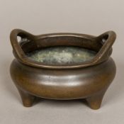 A Chinese bronze twin handled censer Of typical form,