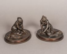 A pair of 19th century patinated bronze models of young ladies Each leaning seated figure scantily