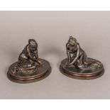 A pair of 19th century patinated bronze models of young ladies Each leaning seated figure scantily