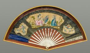 An 18th century French decorated fan Worked with a courting couple and a lute player in a formal