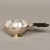 A Georg Jensen Sterling silver sauceboat Of squat lipped form, with an ebony handle,