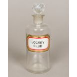 A Victorian apothecary bottle Clear glass with unusual Jockey Club label. 17.5 cm high.