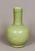 A Chinese celadon ground pottery vase The plain elongated neck above the bulbous body with