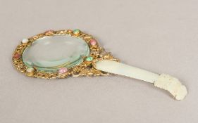 A Chinese jade handled magnifying glass Of pierced form,